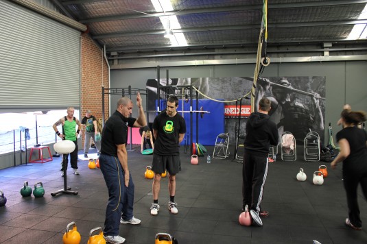 Ivan Denisov teaching kettlebell lifting at Iron Edge