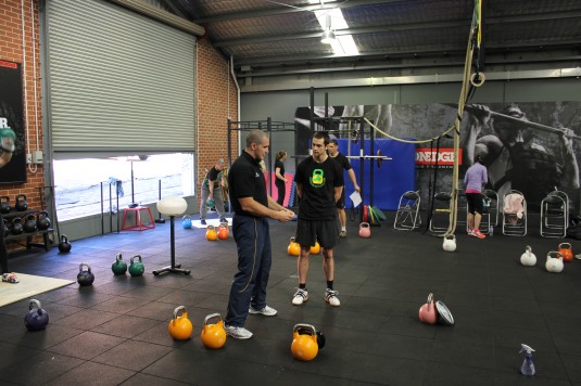 Ivan Denisov teaching kettlebell lifting at Iron Edge